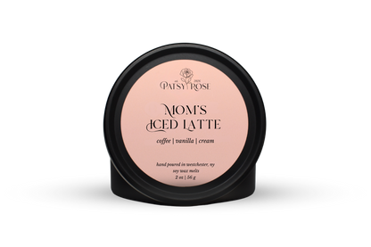 Hand-poured soy wax melts made by Patsy Rose with black tins and a peach label that says "Mom's Iced Latte" with scent notes of "coffee, vanilla, cream".